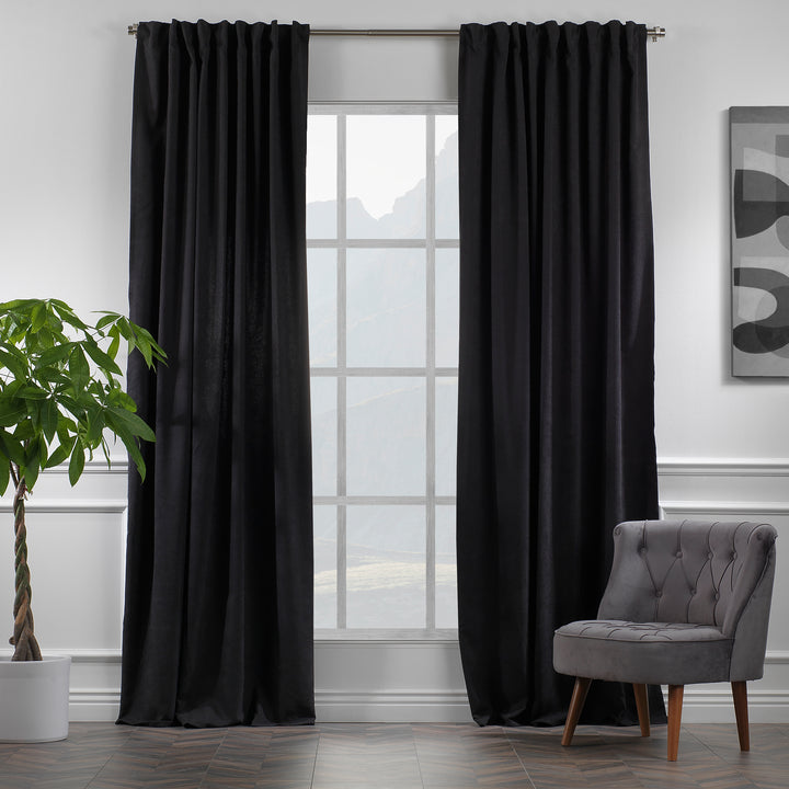 Black velour curtains shown in daylight, highlighting smooth pile texture, deep tone and elegant made‑to‑measure drape.