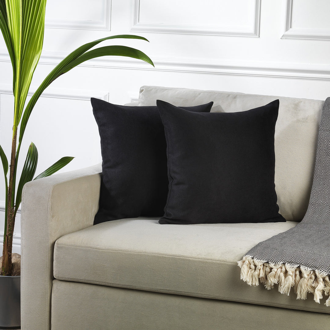 A made to measure cushion cover in classic black velour, shown with a smooth lightweight texture and crisp tailored edges for a bold elegant appearance