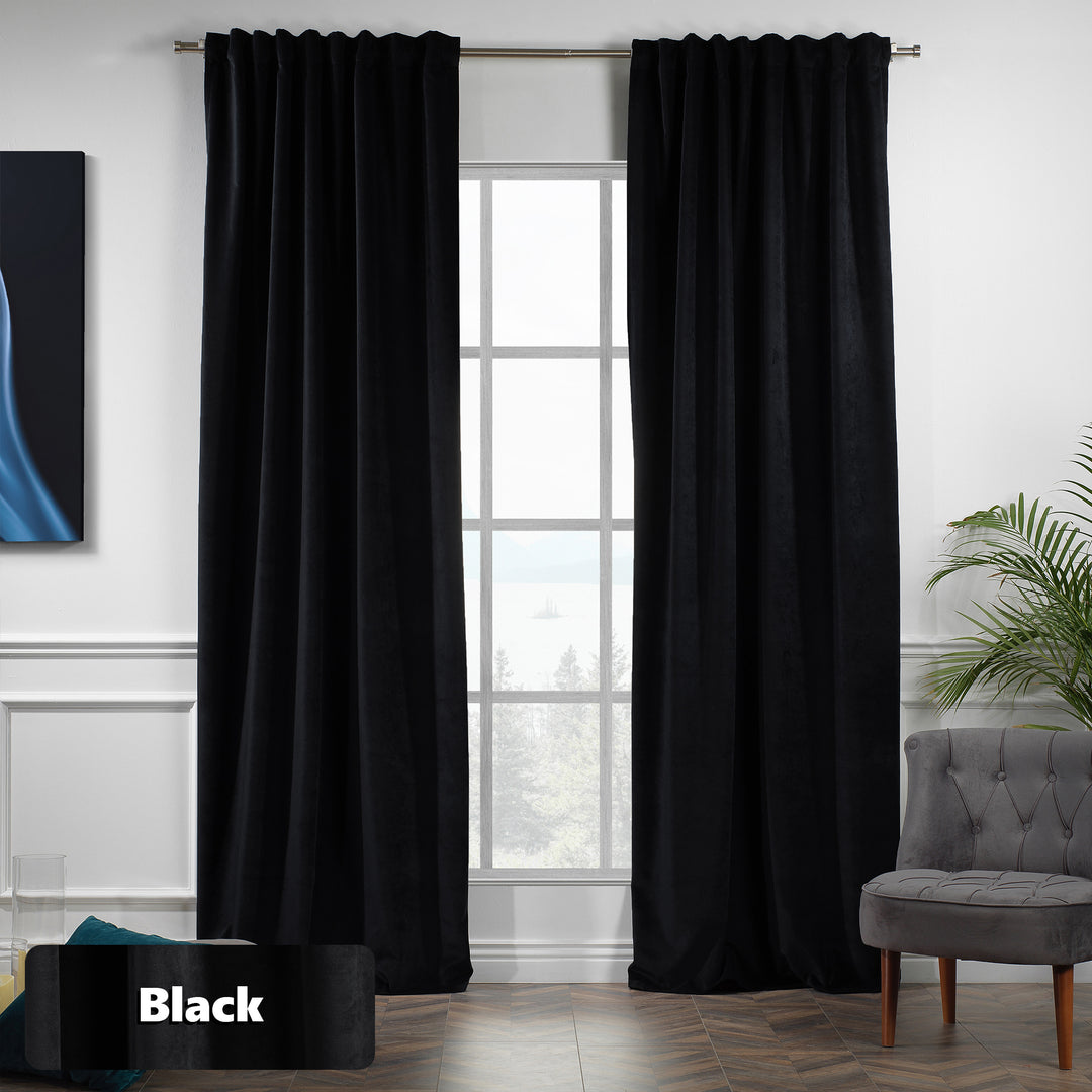 Eyelet‑top black matte velvet curtain panel sliding smoothly on a pole, wide coverage and soft texture.