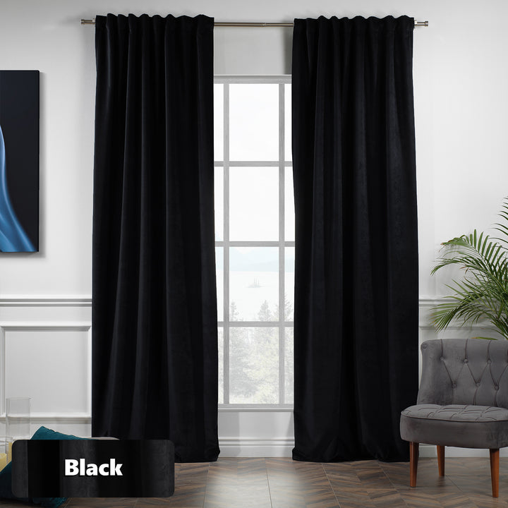 Eyelet‑top black matte velvet curtain panel sliding smoothly on a pole, wide coverage and soft texture.