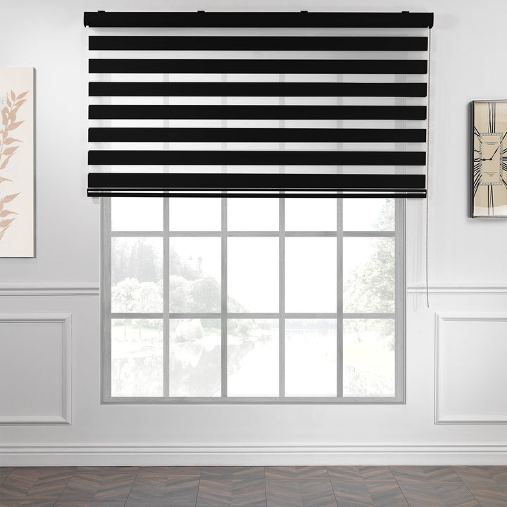 Made to measure zebra roller blind in black, designed with alternating sheer and opaque horizontal stripes for adjustable light control and privacy, highlighting the bold black tone, smooth texture and modern day‑and‑night blind style.