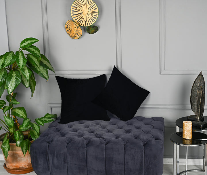 A made to measure cushion cover in classic black matte velvet, displaying a soft velvety surface and clean structured seams for a bold premium finish