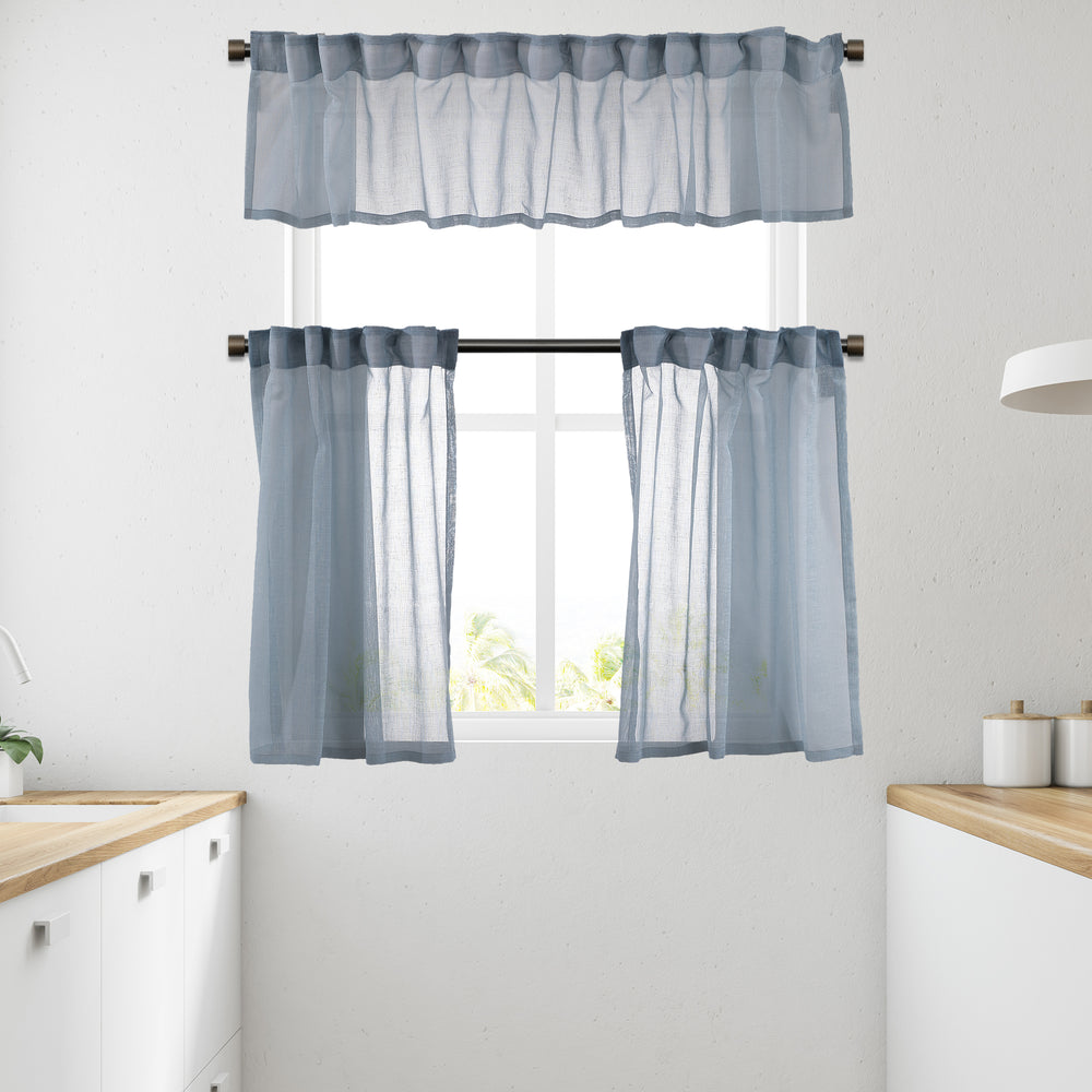 Blue linen‑look sheer valance photographed in daylight, highlighting textured weave and soft translucency.