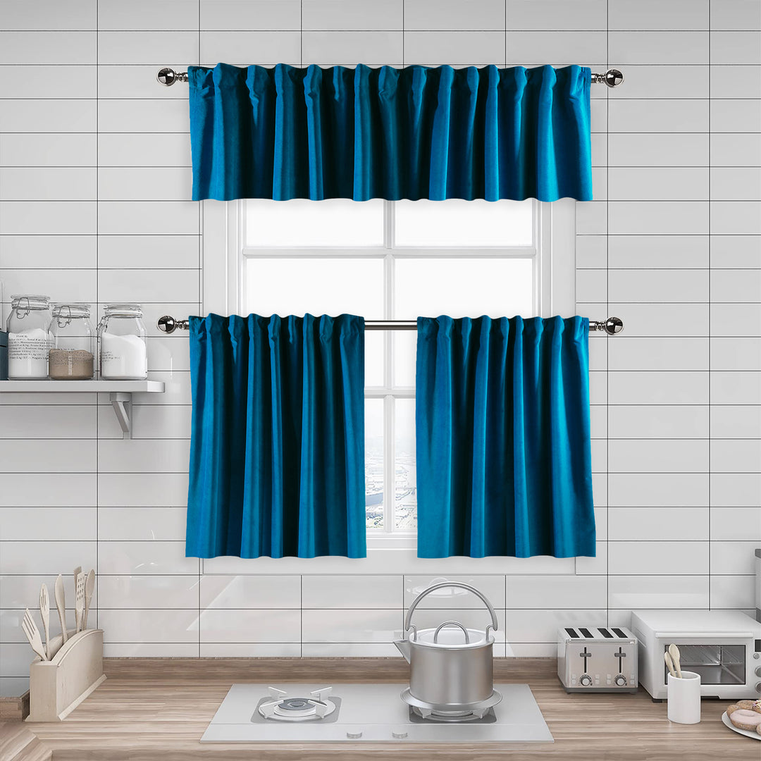 A made to measure kitchen valance in soft blue matte velvet, featuring a velvety surface and clean seams for a calm modern appearance