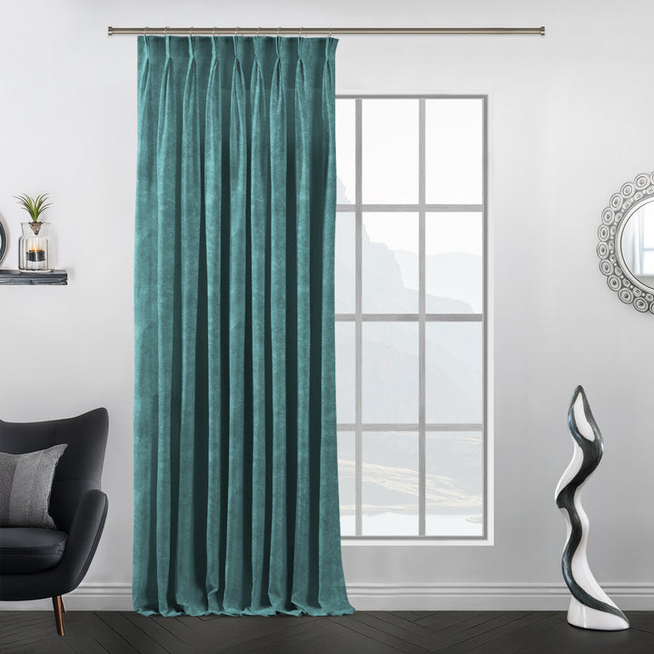 Tailored pinch pleat curtain panel in matte velvet with a smooth, weighty drape.