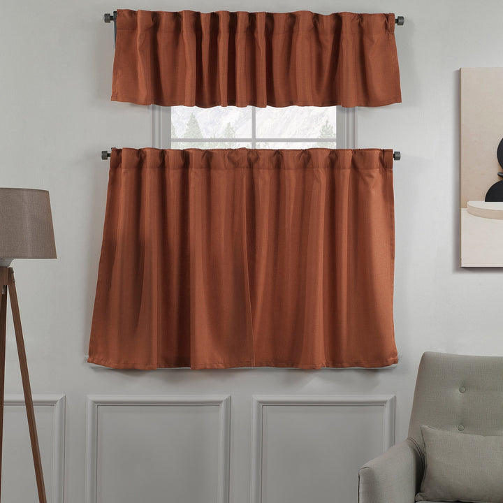 Brick‑toned linen‑look valance with textured weave, warm colour and natural daylight filtering.