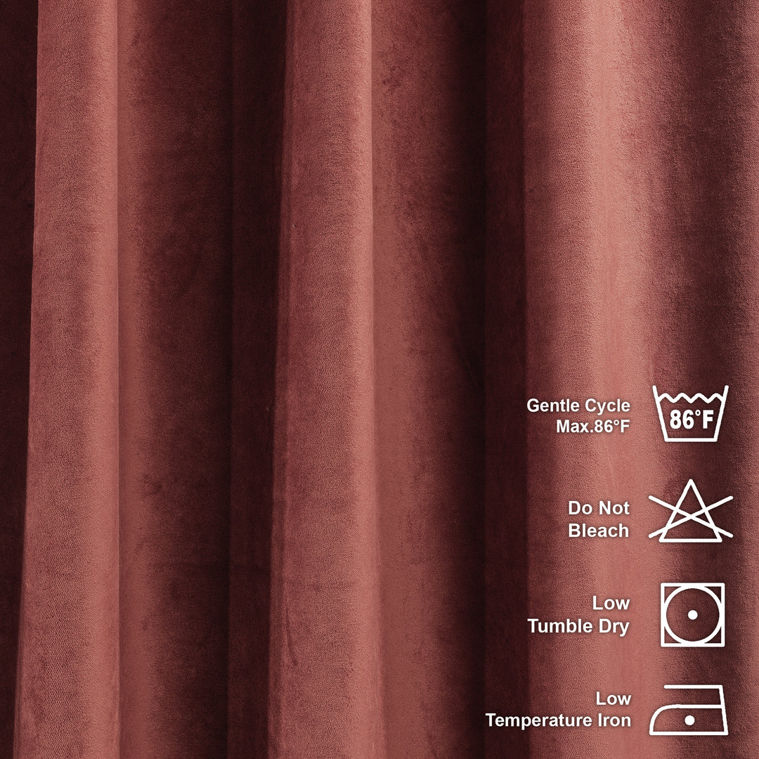 Maroon fabric with laundry care labels on a matching background