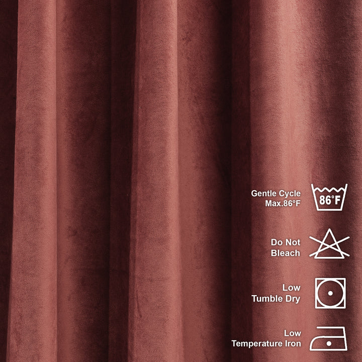 Maroon fabric with laundry care labels on a matching background