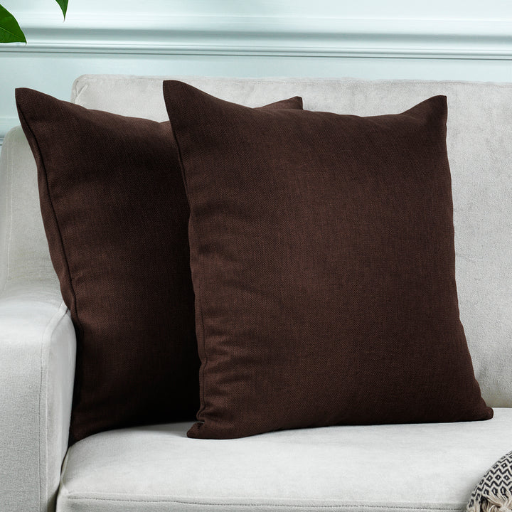 A made to measure cushion cover in warm brown linen‑look fabric, shown with a natural textured weave and clean structured edges for a classic premium finish