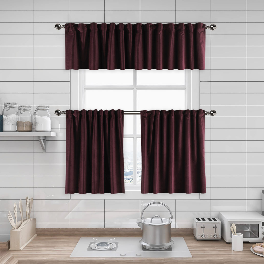 Burgundy kitchen curtain set in a modern kitchen with white tiled walls and wooden floor.