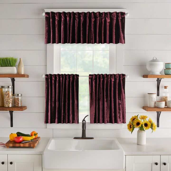 A made to measure valance in deep burgundy shiny velvet, featuring a glossy velvety surface and crisp seams for a bold luxurious appearance