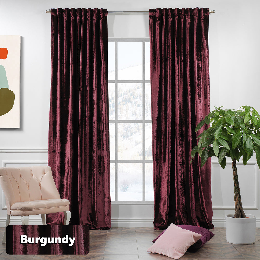 Extra‑long shiny velvet eyelet curtain with polished texture and contemporary metal ring header.