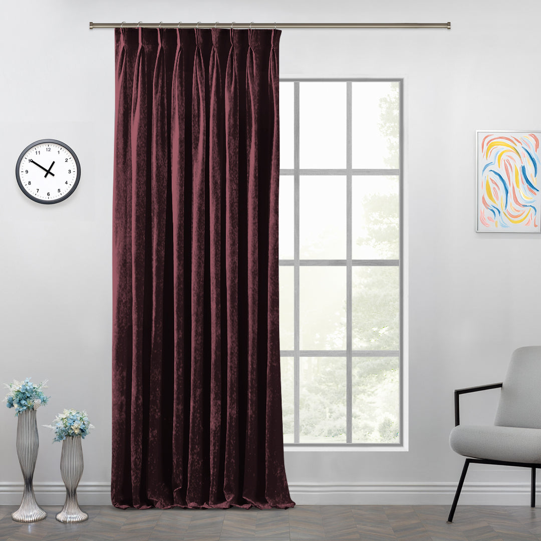 Shiny velvet curtain with sculpted pinch pleats and a polished, fluid full‑length fall.