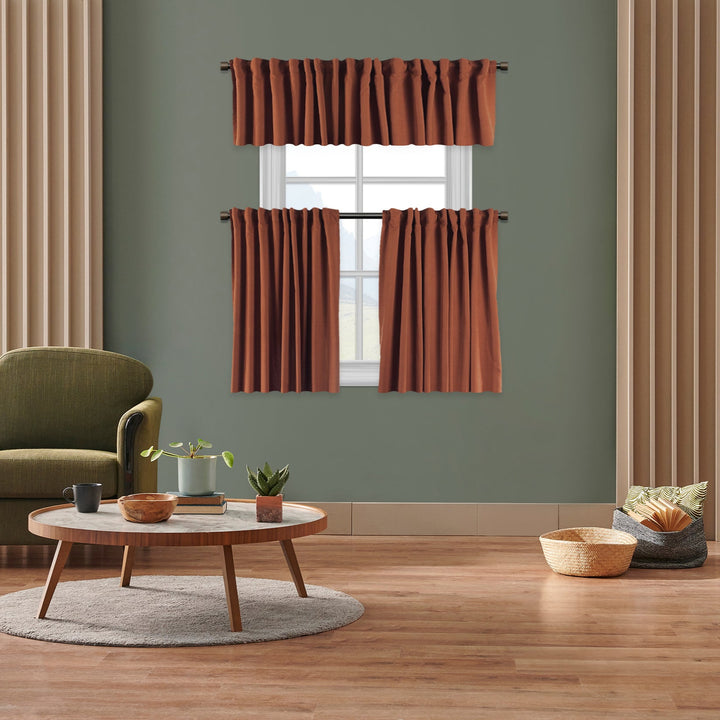 A made to measure kitchen valance in deep burnt‑orange velour, featuring a soft lightweight surface and neatly tailored edges for a warm premium appearance