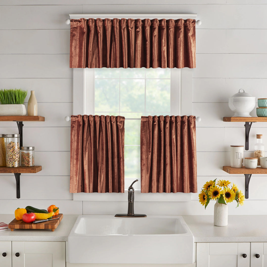 A made to measure valance in deep burnt‑orange shiny velvet, shown with a reflective plush texture and clean edges for a warm elegant finish