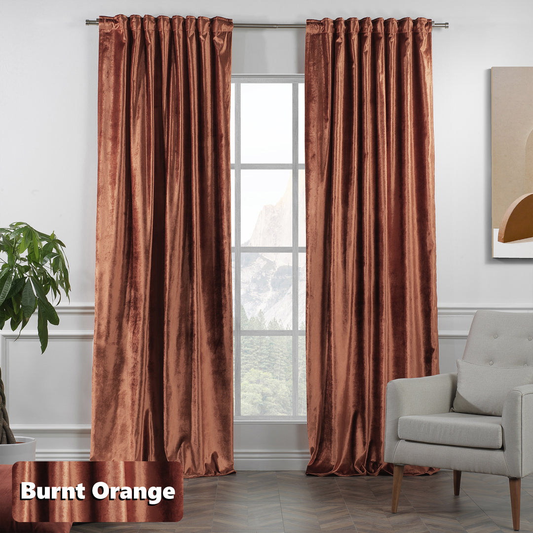 Luxury shiny velvet eyelet curtain panel with extended length and a smooth, glossy drape