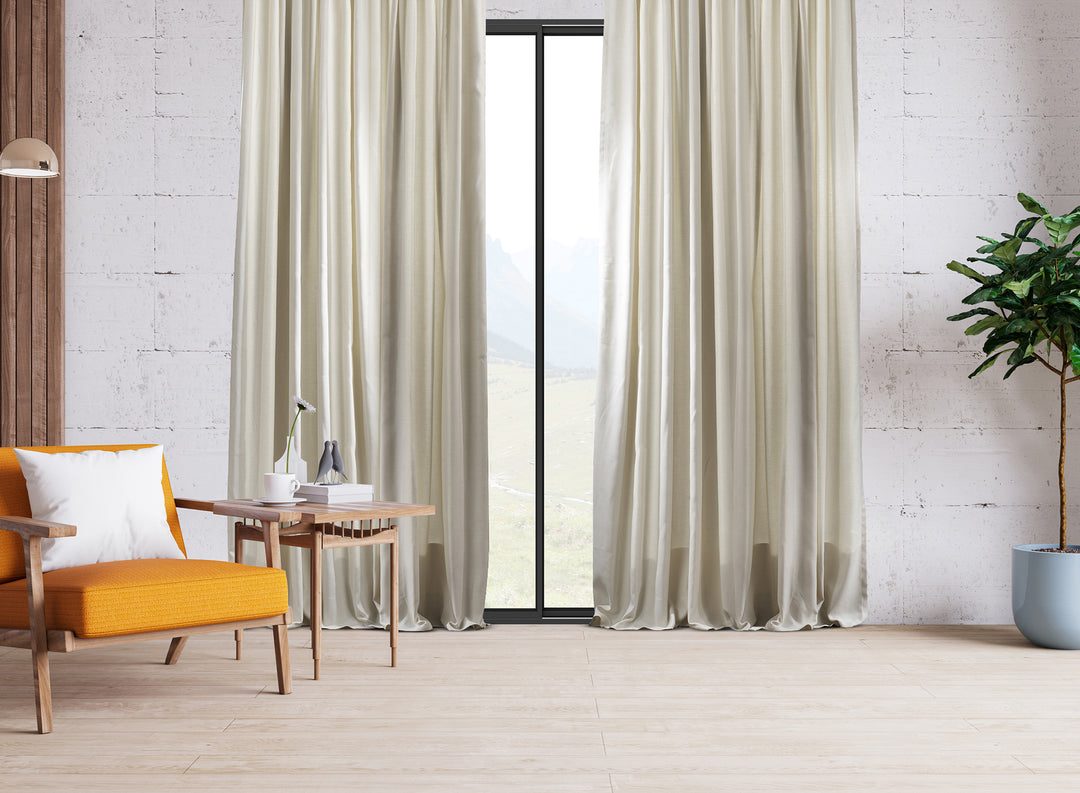 An extra‑long wide linen‑look door curtain in cream, showing refined weave, smooth pleats and a bright natural finish