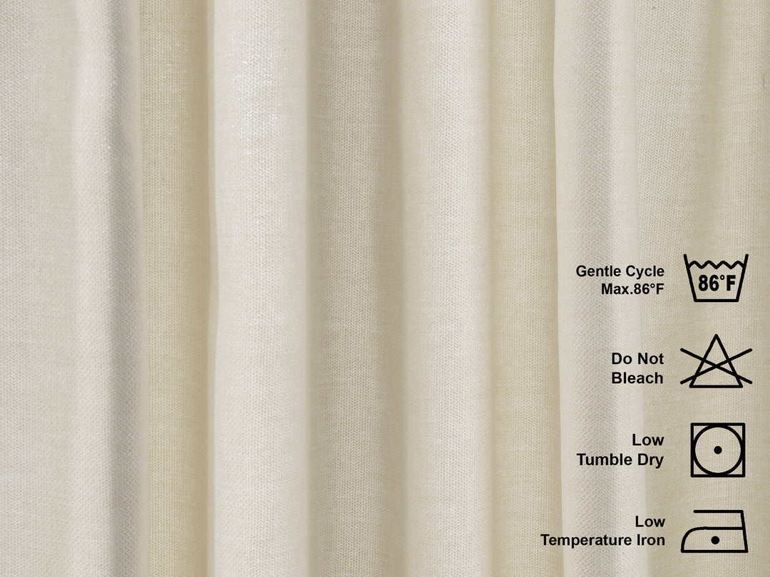 Textile with washing and care instructions on a beige linen look curtains fabric background