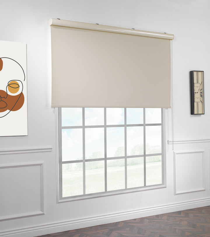 A made to measure cream room darkening roller blind displayed with a soft matte texture and tidy straight lines providing balanced dimming