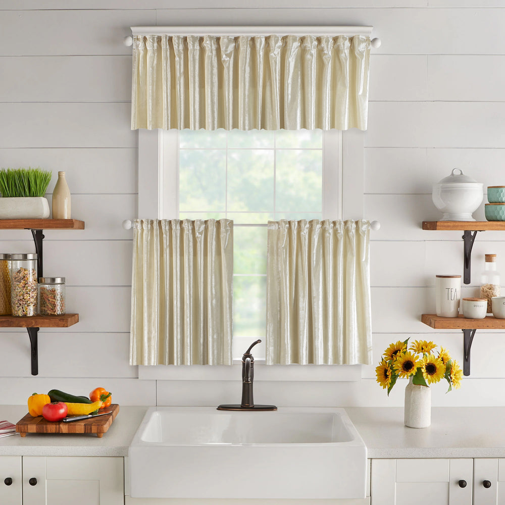 A made to measure valance in soft cream shiny velvet, featuring a reflective plush texture and crisp seams for a bright elegant finish
