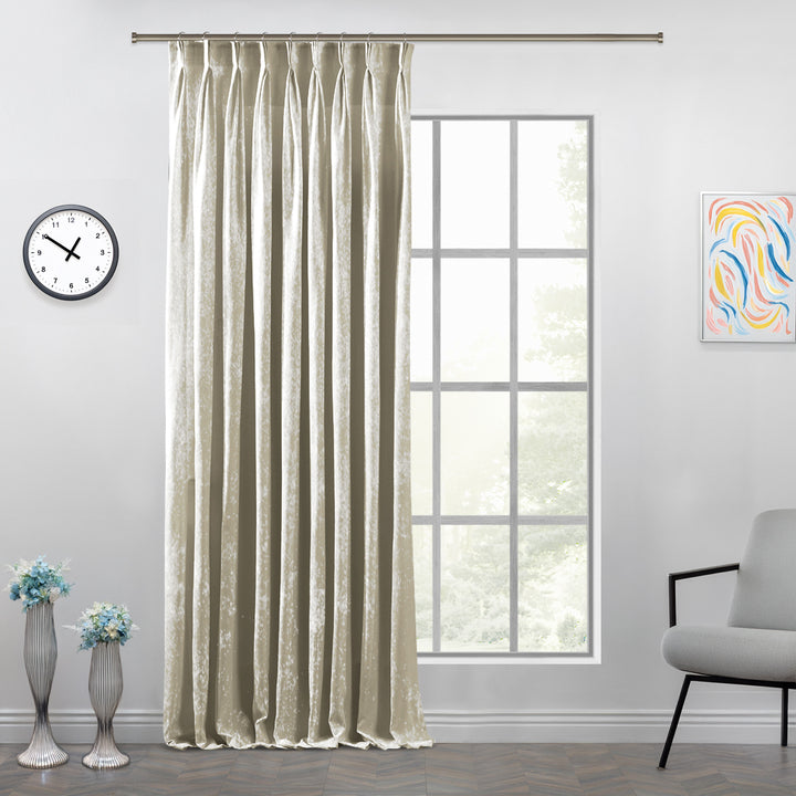 Cream shiny velvet pinch pleat curtain panel with structured pleats and a refined full‑length silhouette.