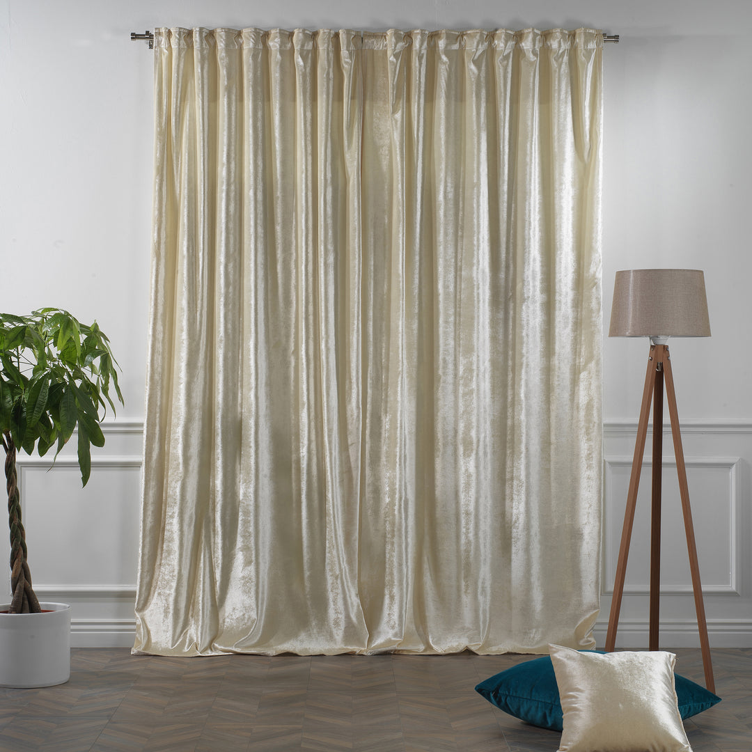 Cream glossy velvet multi‑way curtain with adaptable hanging styles and a premium flowing silhouette.