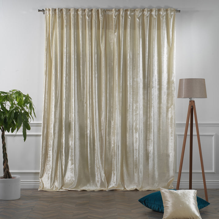 Cream glossy velvet multi‑way curtain with adaptable hanging styles and a premium flowing silhouette.