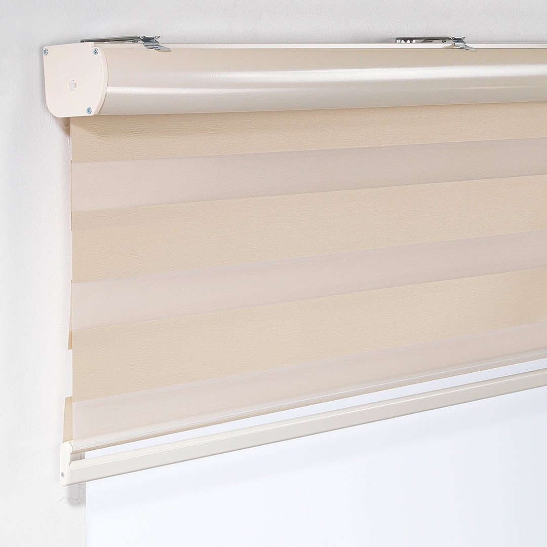 Made to measure cream zebra roller blind featuring warm-toned alternating sheer and dim‑out stripes for soft light control and balanced privacy, highlighting its gentle creamy shade, smooth woven texture and elegant contemporary day‑and‑night blind design.