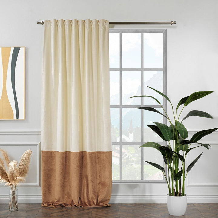 A made to measure matte velvet block curtain in cream and brown, shown with soft drape, smooth folds and a warm two‑tone finish