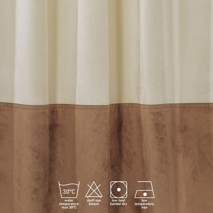  A close‑up of a cream and brown matte velvet block curtain, displaying the subtle texture and clean colour separation