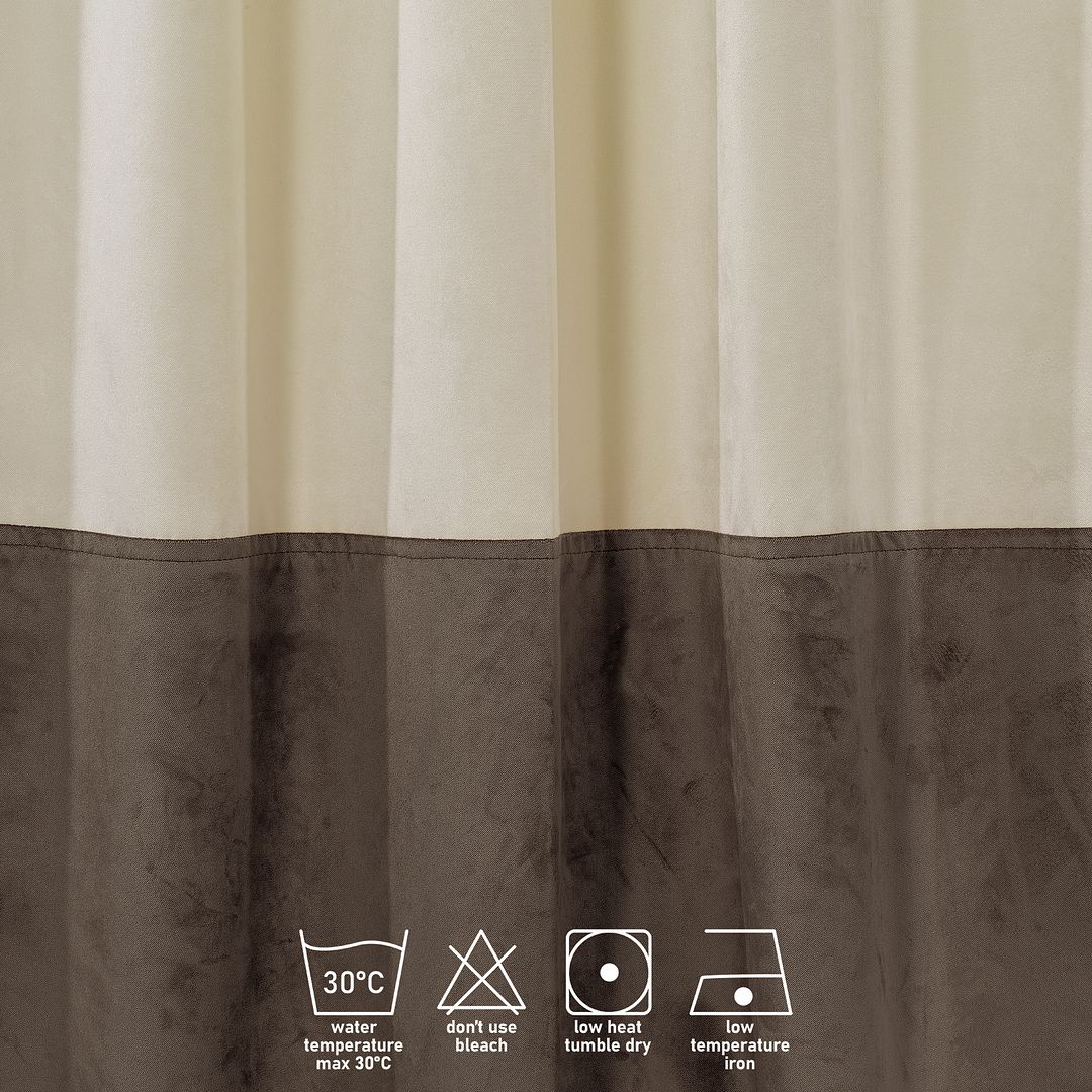 A made to measure matte velvet block curtain in cream and cappuccino, shown with soft draping folds and a refined two‑tone finish