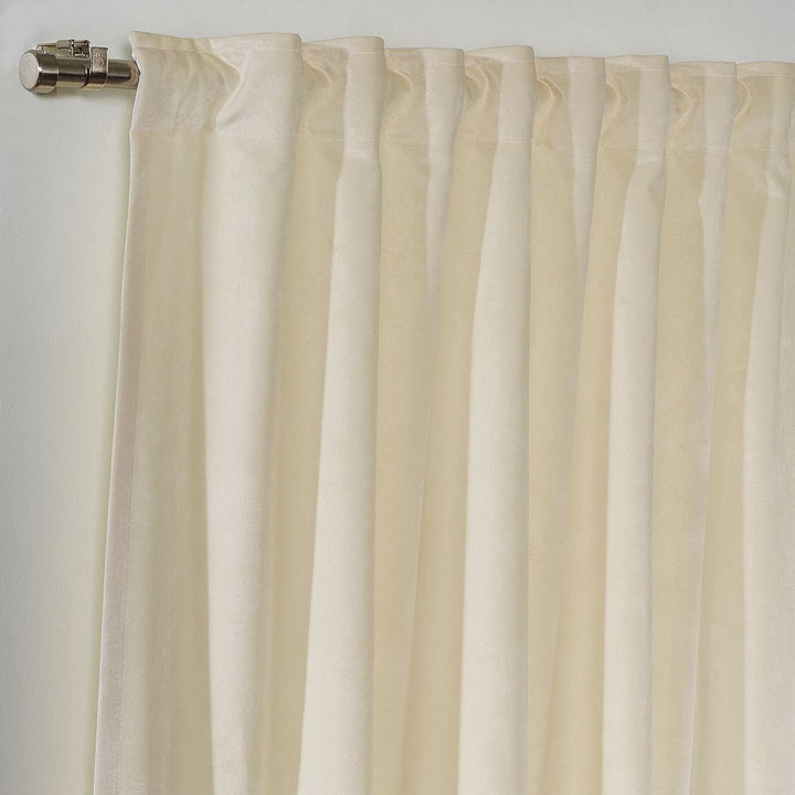 A close‑up of a cream and cappuccino matte velvet block curtain, displaying the smooth texture and gentle warm contrast