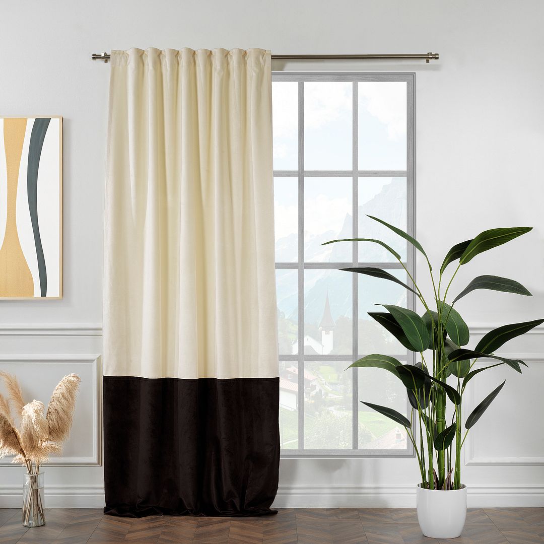 A made to measure matte velvet block curtain in cream and dark brown, displayed with tailored pleats and a soft premium drape
