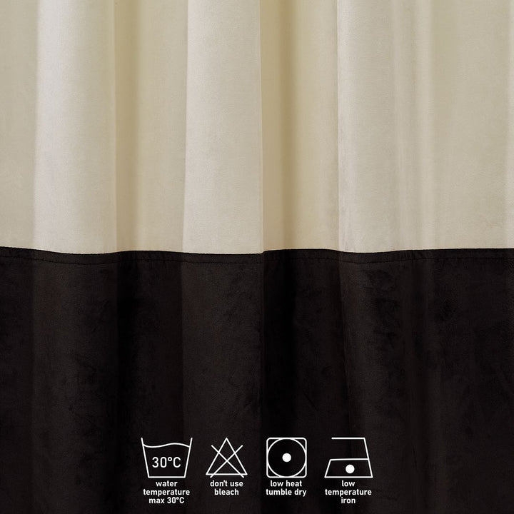 A close‑up of a cream and dark brown matte velvet block curtain, highlighting the smooth weave and rich tonal contrast