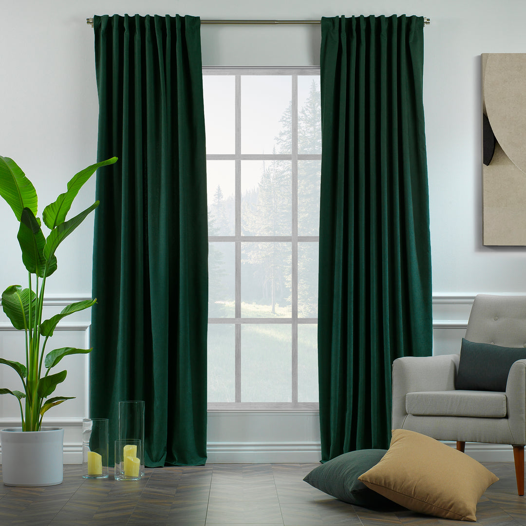 Dark green velour curtains shown in daylight, highlighting rich tone, smooth pile and elegant soft drape.
