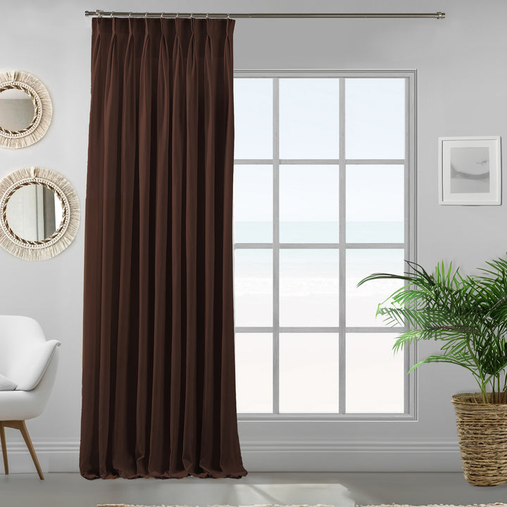 Pinch pleated dark brown velour curtain panel showing soft drape and refined matte finish.