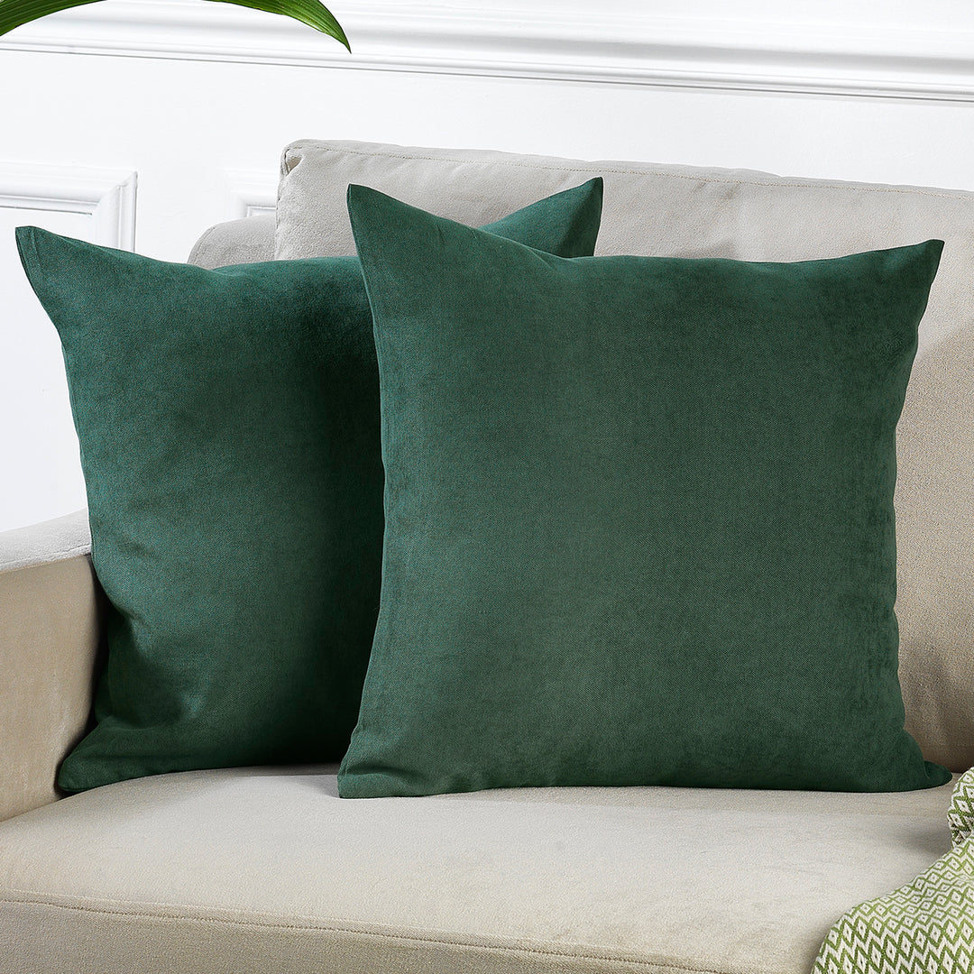 A made to measure cushion cover in deep forest‑green velour, shown with a plush lightweight surface and crisp edges for a rich natural finish