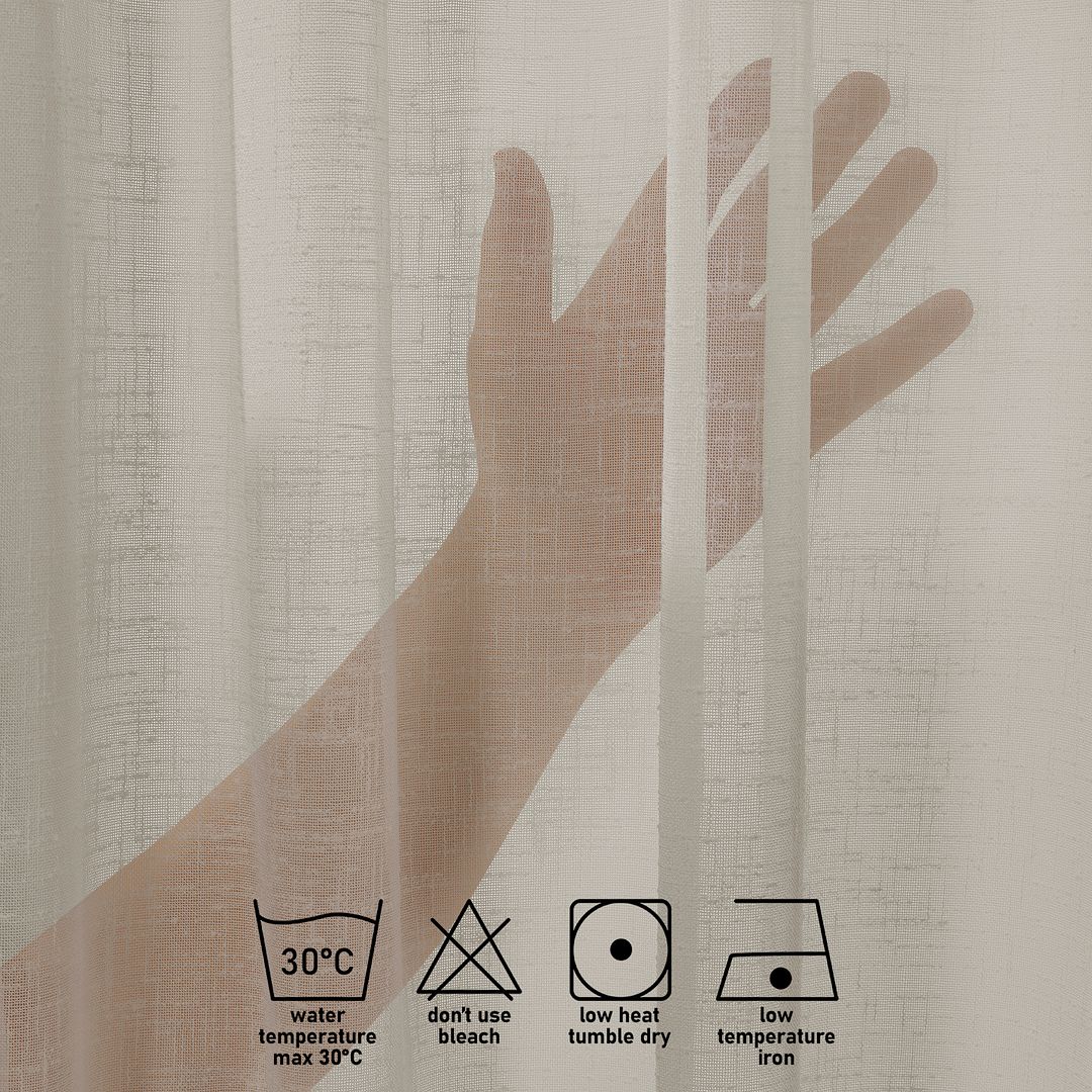 Close-up of beige linen semi sheer with laundry label