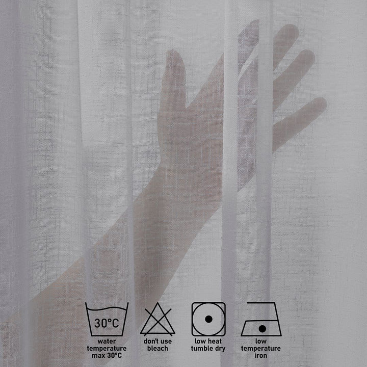 Textured light gray curtain with hand holding a sheer panel, showing care label symbols.