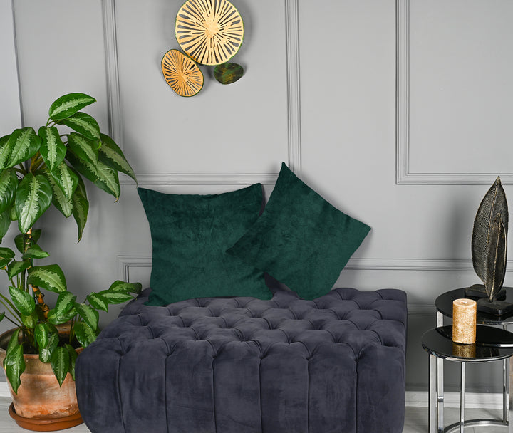 A made to measure cushion cover in deep jungle‑green matte velvet, displaying a velvety surface and neatly tailored edges for a rich natural finish