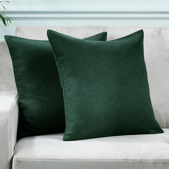 A made to measure cushion cover in deep duck‑green linen‑look fabric, shown with a natural textured weave and crisp refined edges for a rich earthy finish