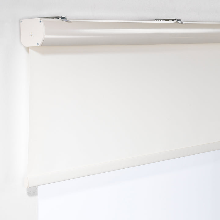 A close‑up of an ecru room darkening roller blind made to measure, showing its soft woven texture and clean refined finish