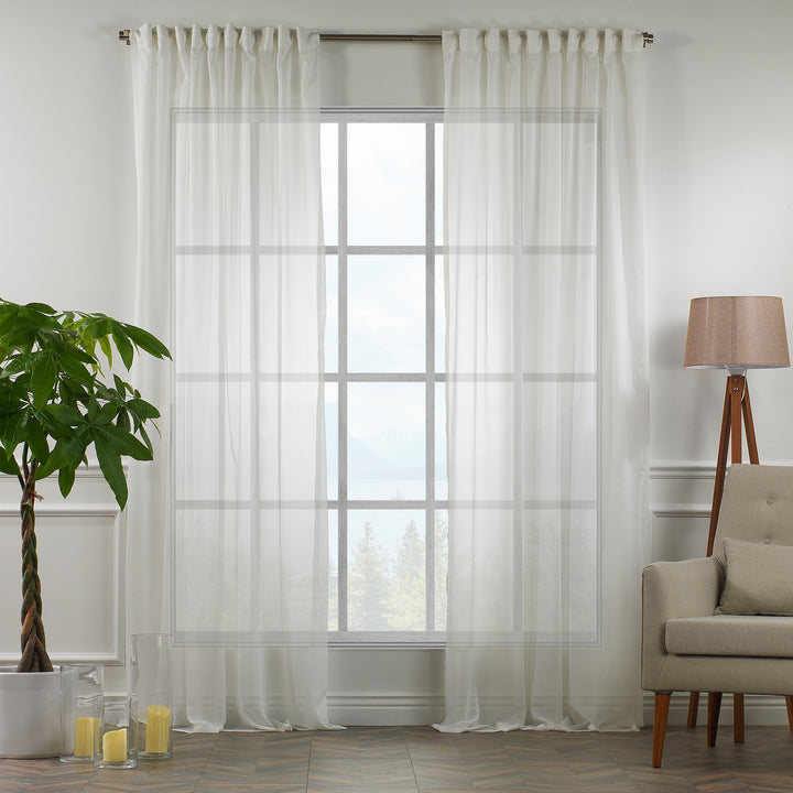 Made‑to‑measure extra‑long and extra‑wide Ecru silk‑crepe sheer curtain in daylight, showing refined silk texture, soft translucency and a smooth elegant drape.