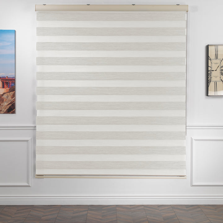 Made to measure zebra roller blind in ecru, featuring alternating sheer and opaque horizontal stripes for adjustable light control and privacy, showcasing the soft neutral tone, smooth texture and contemporary day‑and‑night blind design.