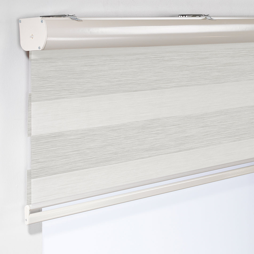Made to measure zebra roller blind in ecru, featuring alternating sheer and opaque horizontal stripes for adjustable light control and privacy, showcasing the soft neutral tone, smooth texture and contemporary day‑and‑night blind design.