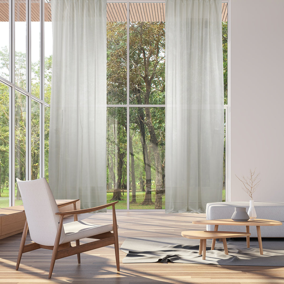 Extra‑wide made‑to‑measure Ecru sheer silk‑crepe curtain featuring a lightweight airy drape and softly diffused daylight.
