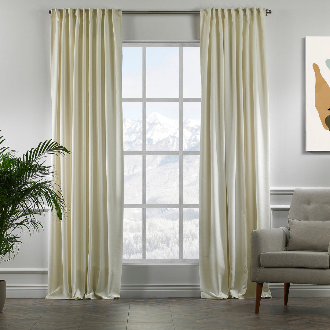 Ecru velour curtains in full view, showing soft pile texture, warm undertone and elegant made‑to‑measure drape.