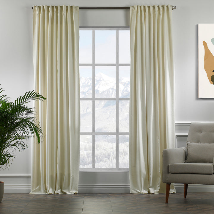 Ecru velour curtains in full view, showing soft pile texture, warm undertone and elegant made‑to‑measure drape.