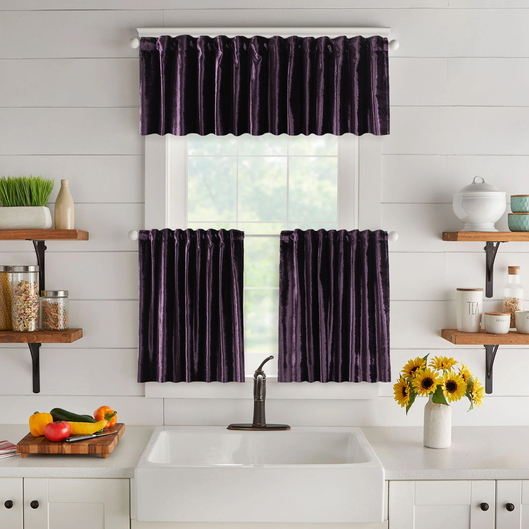 A made to measure valance in deep eggplant‑purple shiny velvet, shown with a smooth reflective surface and crisp edges for a bold elegant finish