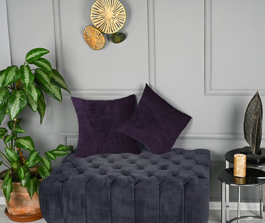 A made to measure cushion cover in deep eggplant‑purple matte velvet, shown with a plush smooth texture and crisp structured seams for a rich premium style